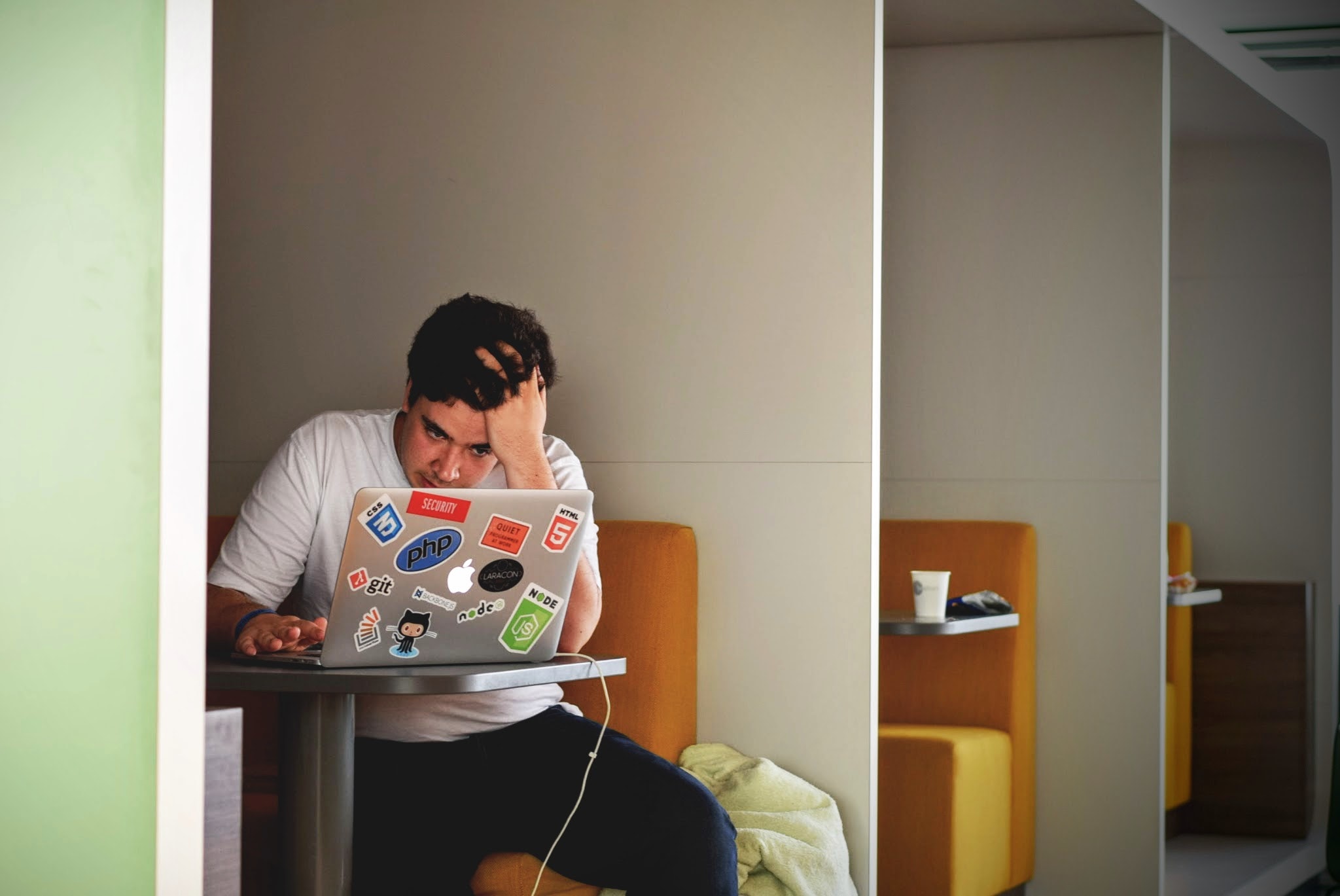 person sitting with laptop